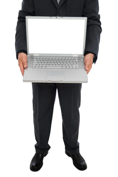 Empresário segurando laptop — Fotografia de Stock