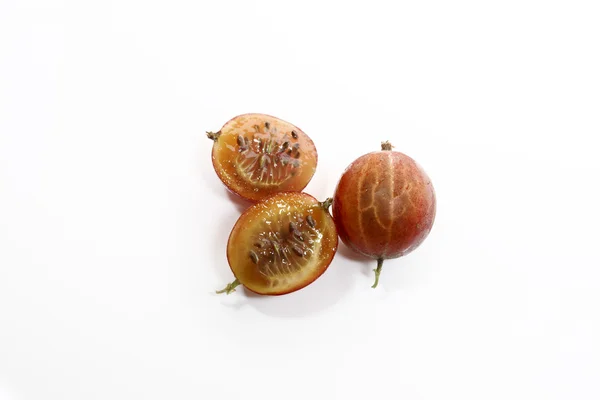 Whole and sliced red gooseberries — Stock Photo, Image