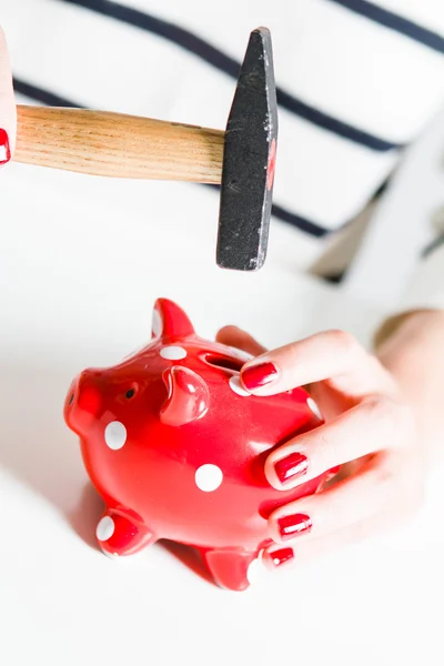 Red piggy bank and hammer — Stock Photo, Image
