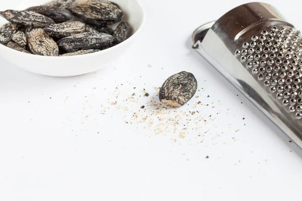 Tonka beans and grater — Stock Photo, Image