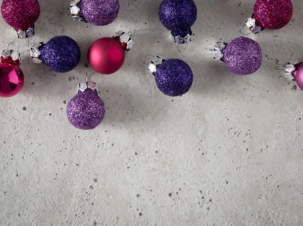 Baubles on concrete, copy space — Stock Photo, Image