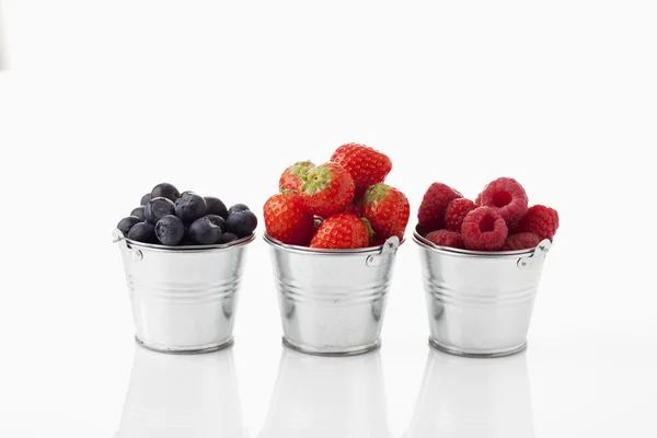 Zinc little buckets with berries — Stock Photo, Image