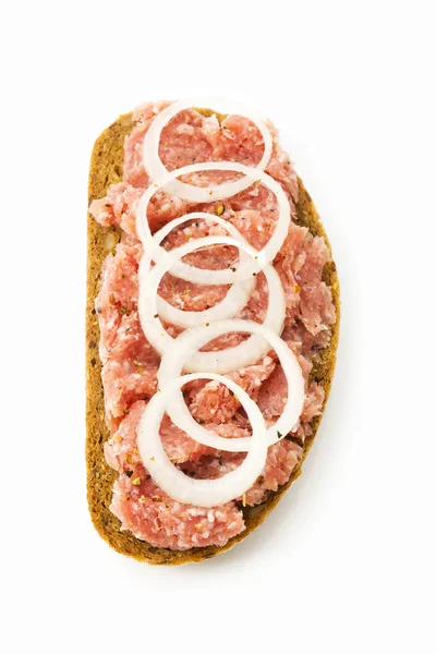 Minced pork with onions and ham on bread — Stock Photo, Image