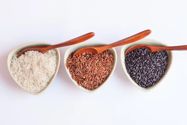 Different rice in bowls — Stock Photo, Image