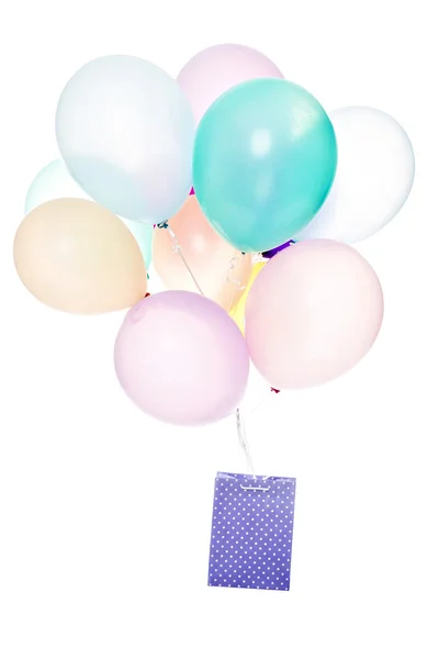 Kleurrijke ballons met boodschappentas — Stockfoto