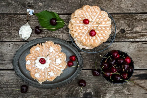 Waffles with cherries on plate — Stock Photo, Image