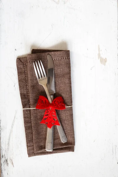 Decorated cutlery on brown napkin Stock Image