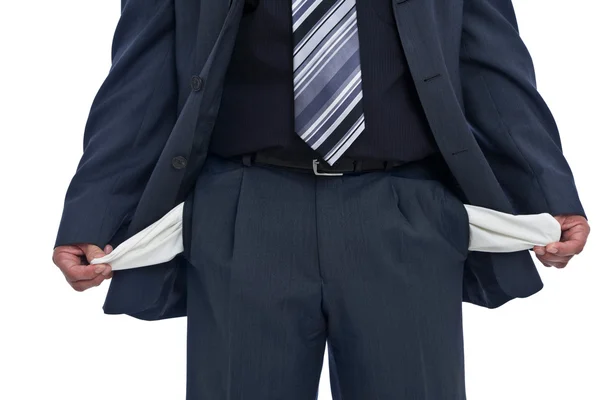 Businessman with empty pockets Royalty Free Stock Images