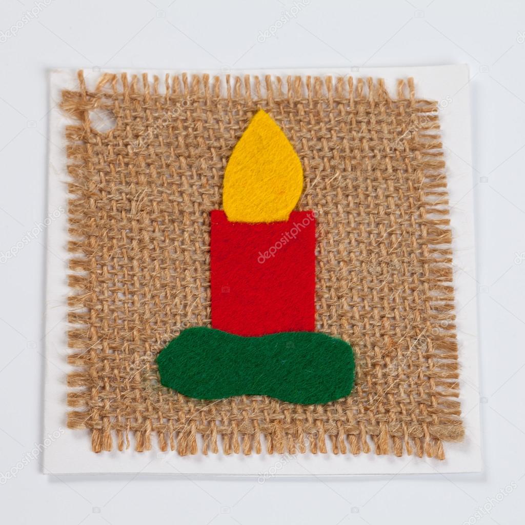 Christmas candle on linen