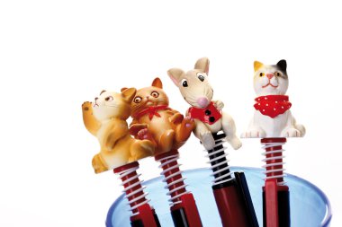 Pens with animal figurines  clipart
