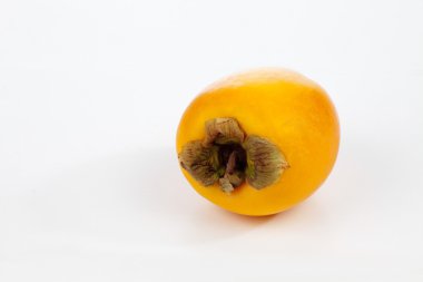 Bir sarı kaki meyve