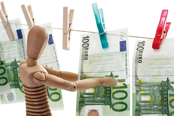 Figurinha de madeira com notas de 100 euros — Fotografia de Stock