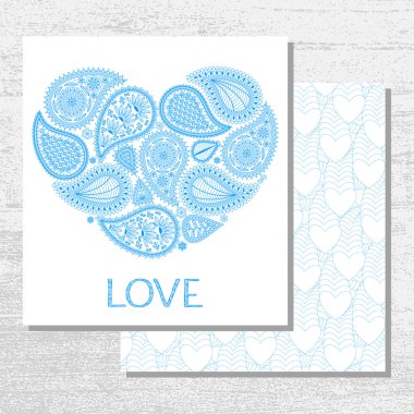Floral paisley background with ethnic ornament and heart shape. Romantic design in blue colors and text Love. Greeting card. Vector illustration.