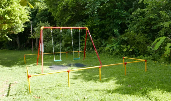 Colourful park swing — Stockfoto