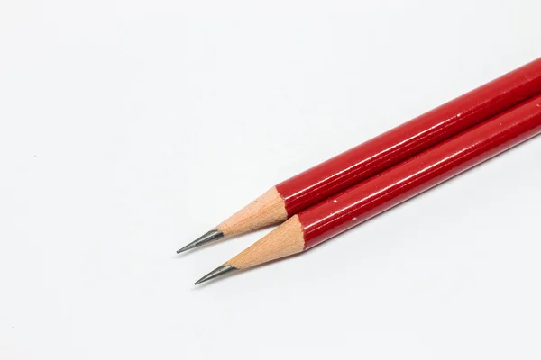 Deux crayons rouges sur fond blanc — Photo