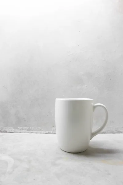 White coffee mug on concrete table