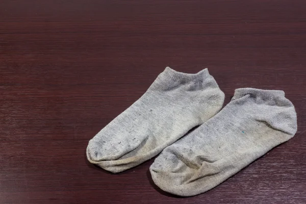 Dreckige Socken auf dem Boden — Stockfoto