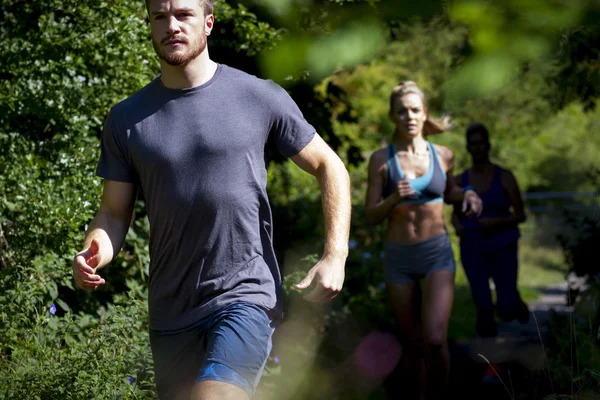 Three People Running — Stock Photo, Image