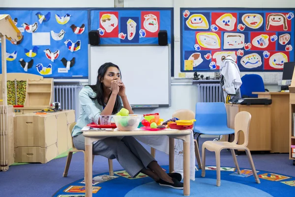 Stressed Nursery Teacher — Stock Photo, Image