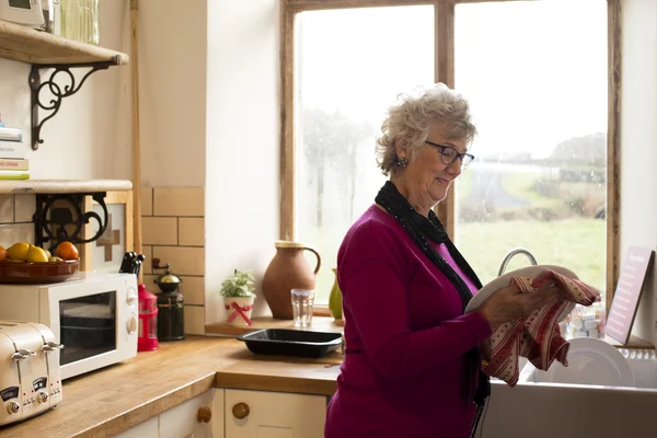 Grandma Drying Dishes — Stock Photo, Image