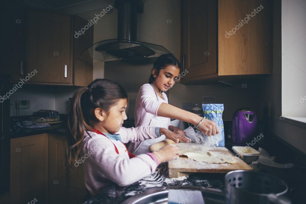 Sisters Making Biscuits Stock Photo by ©DGLimages 122632340