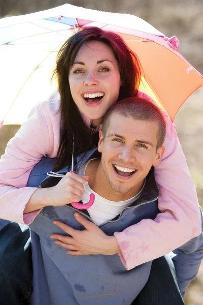 Couple having fun in the rain — Stok fotoğraf