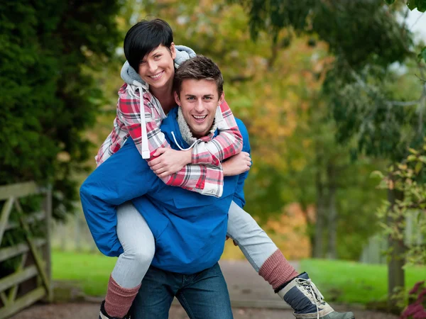 Couple playing around outdoors — Stok fotoğraf