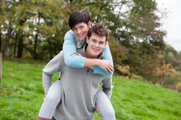 Couple playing around outdoors — Stok fotoğraf