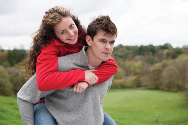 Couple playing around outdoors — Stok fotoğraf