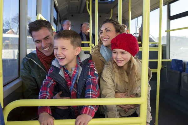 Happy family on the bus — Stock Photo, Image