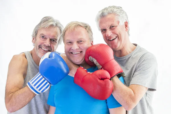 Three men posing in boxing gloves — Stock Photo, Image