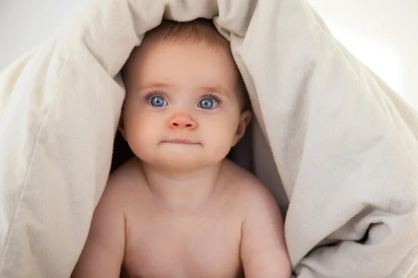 Baby Playful in Bed Stock Photo