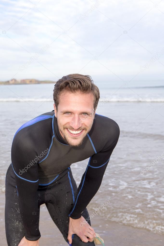 Man In Wetsuit on Beach
