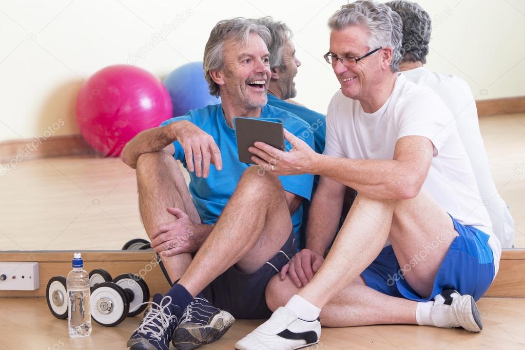 Men relaxing after gym workout 