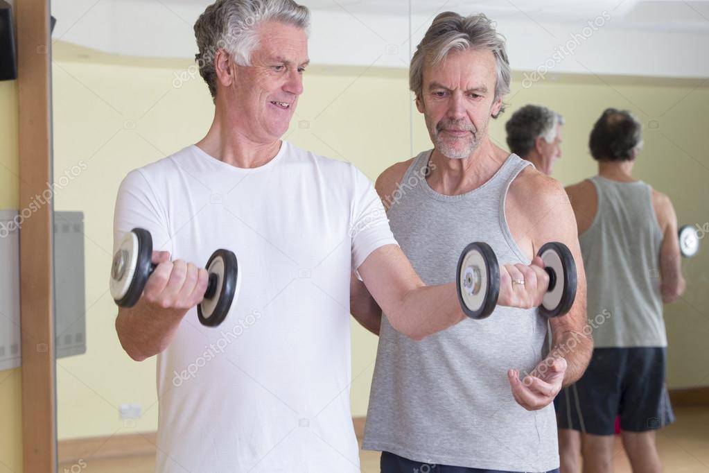 Men using weights together