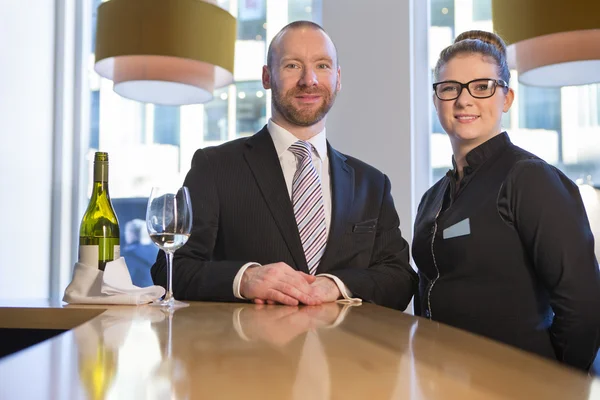 Bar staff smiling for the camera — Stock Photo, Image