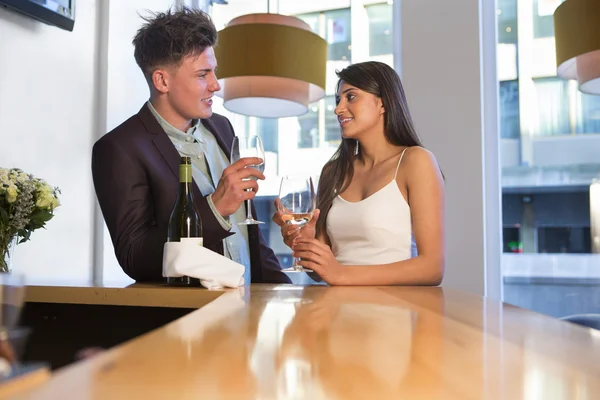 Sharing a bottle of bubbly at the bar — Stock Photo, Image