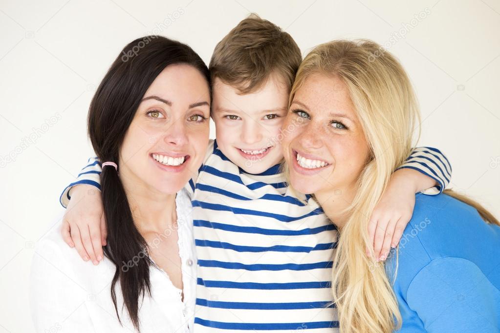 Female couple posing with their son 