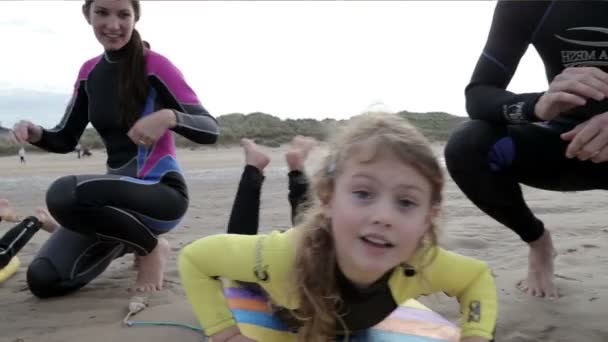 Family of four body boarding in the sea — Stock Video