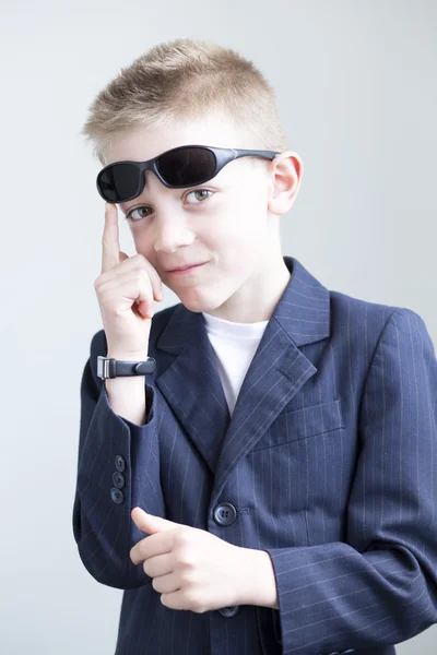 Young boy posing like a spy — Stock Photo, Image