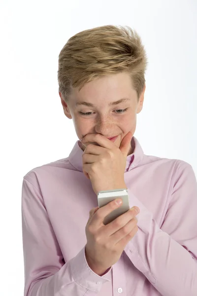 Boy shocked at something on his phone — Stock Photo, Image