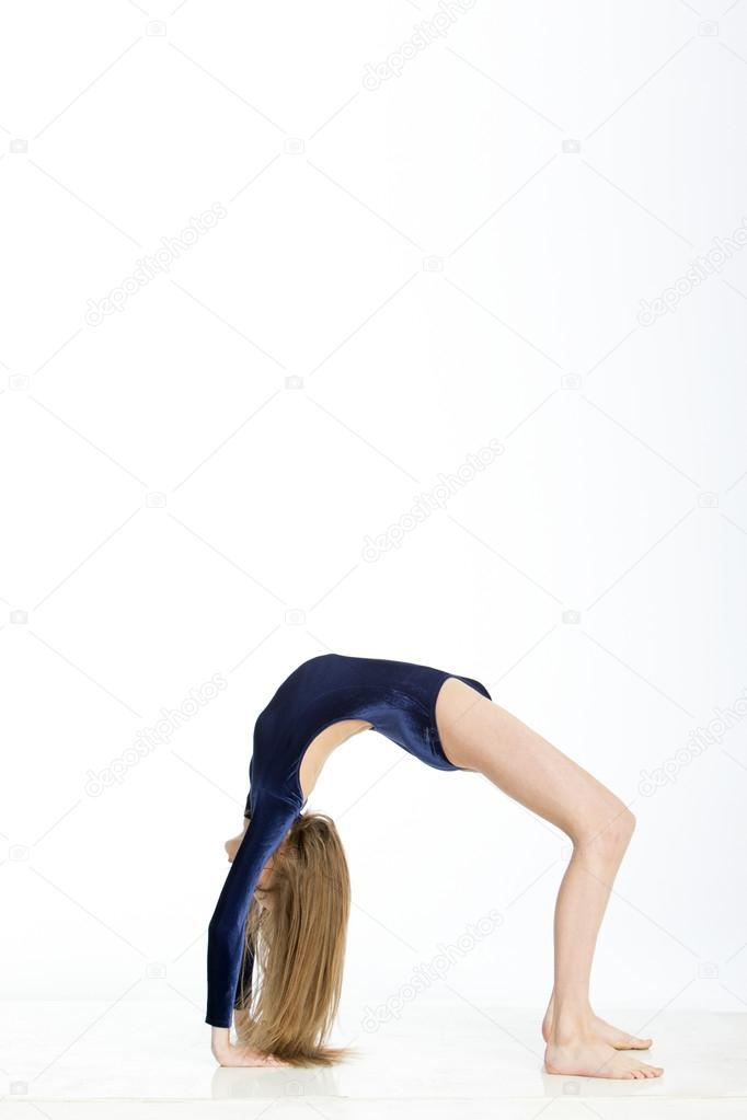 Gymnast in crab position Stock Photo by ©DGLimages 81392526