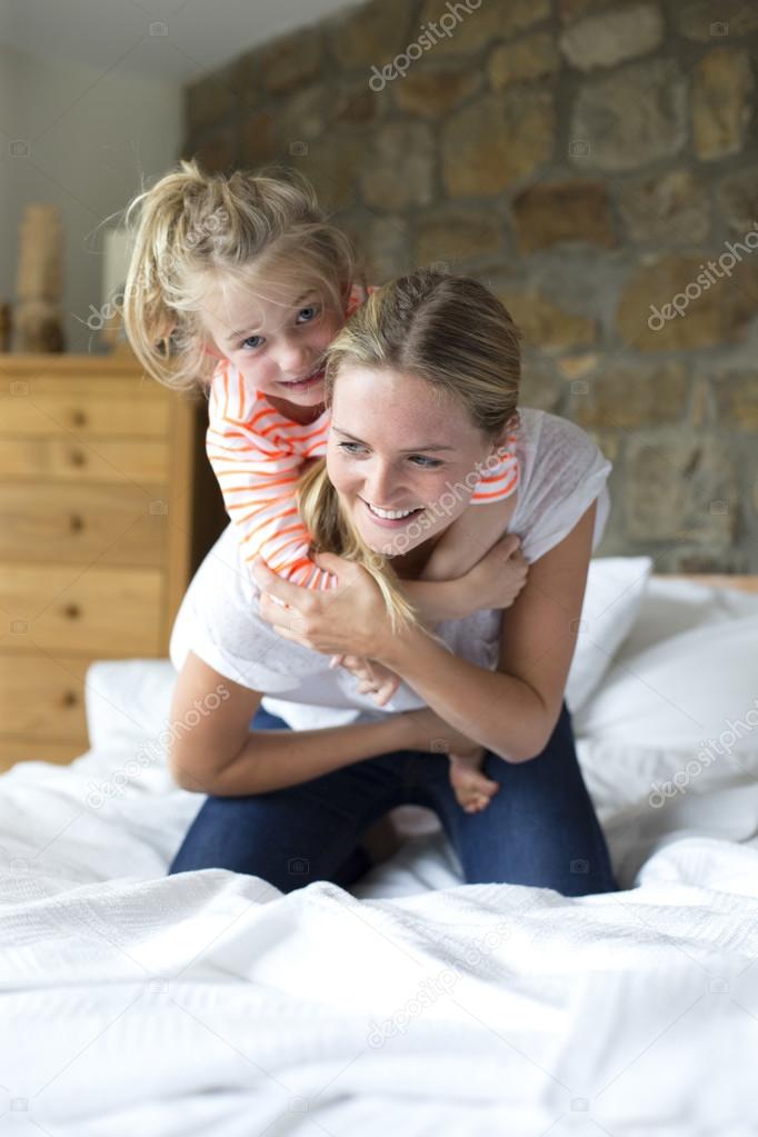 Mother and daughter playing together
