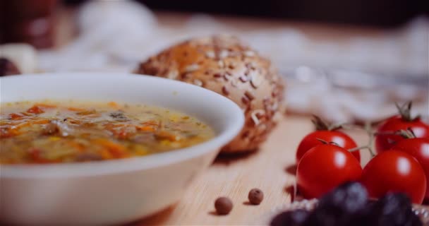 Soup In Bowl Amidst Various Ingredients Assorted On Wooden Table — Stock Footage Soup In Bowl Amidst Various Ingredients Assorted On Wooden Table Royalty Free Stock Footage