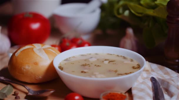 Soup In Bowl Amidst Various Ingredients Assorted On Wooden Table — Stock Footage Soup In Bowl Amidst Various Ingredients Assorted On Wooden Table Royalty Free Stock Video