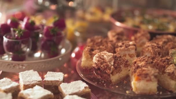 Close up of sweets and cakes on table at wedding reception — Stock Video