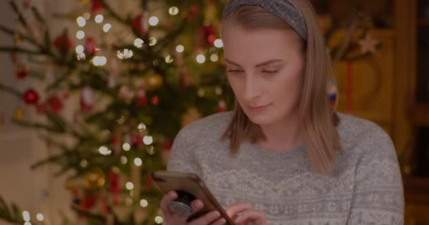 Woman Browsing Internet on Mobile Phone — Stock Video