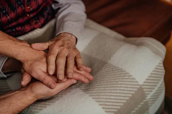 Comforting Elderly Senior Man Hands Close Up. Giving Care.