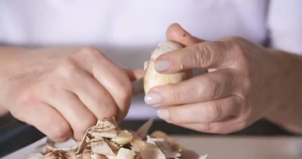 Cleaning wild mushroom with kitchen knife — Stock Video
