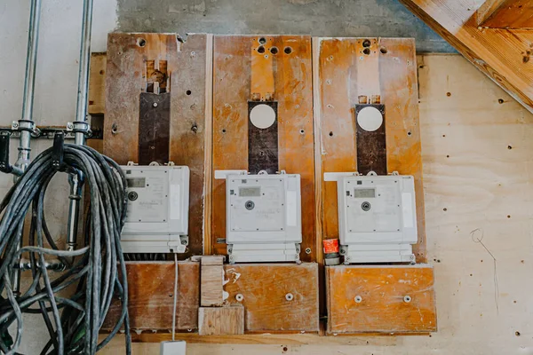 electricity meter device on wall of house